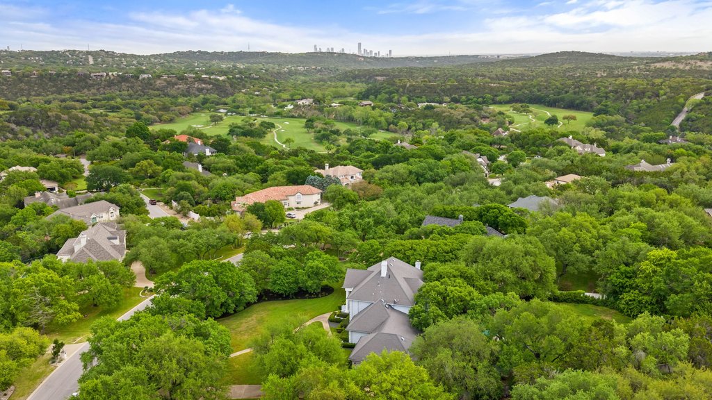 7609 Sandia Loop Austin, TX 78735 - Photo 39 of 40 Expansive aerial landscape highlighting a residential area amidst abundant mature trees