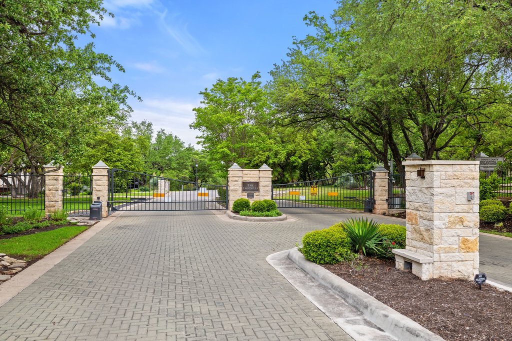 7609 Sandia Loop Austin, TX 78735 - Photo 40 of 40 The stone-monument entry and controlled access provide a sense of security and exclusivity, welcoming you into this quiet, well-maintained neighborhood within Barton Creek.