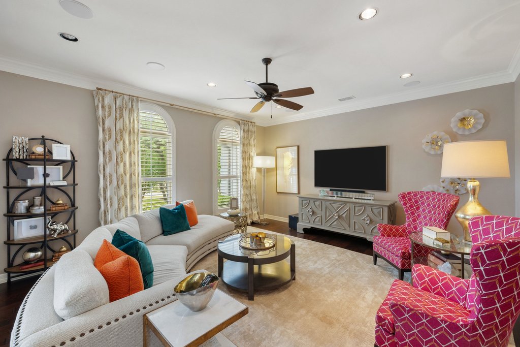 7609 Sandia Loop Austin, TX 78735 - Photo 9 of 40 The front den offers a sophisticated yet comfortable secondary living space, detailed with classic crown molding, recessed lighting, and large windows that overlook the private acreage.