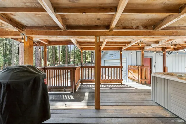 a view of a porch with wooden floor