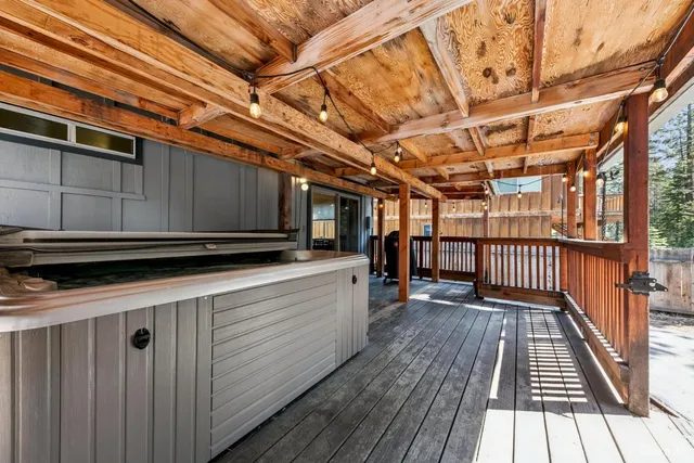 a view of a balcony with wooden floor