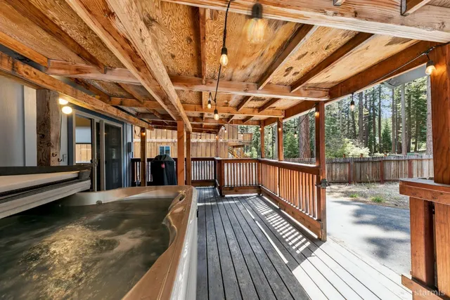 a view of a balcony with wooden floor