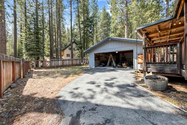 a view of a chair and tables in the patio