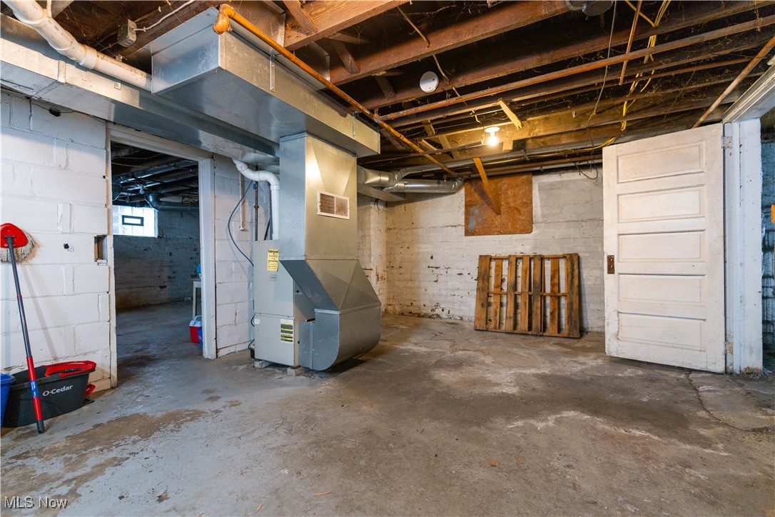 900 4th Street Southwest Canton, OH 44707 - Photo 23 of 31 Below grade area with heating unit