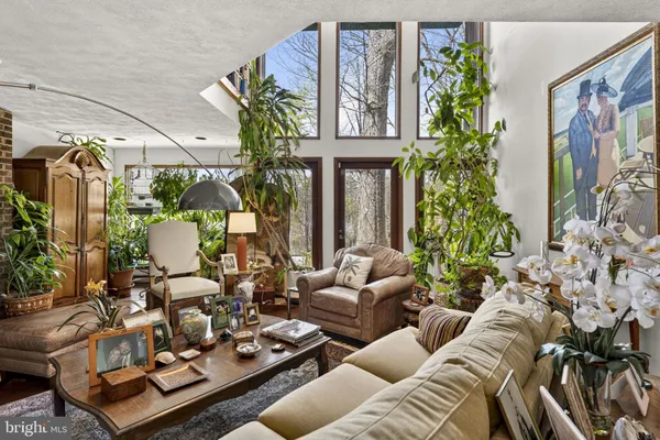 a living room with lots of furniture and a flat screen tv