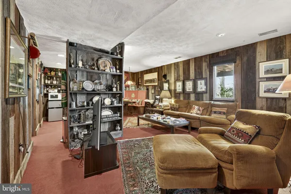 a kitchen with kitchen island granite countertop a oven a refrigerator and cabinets