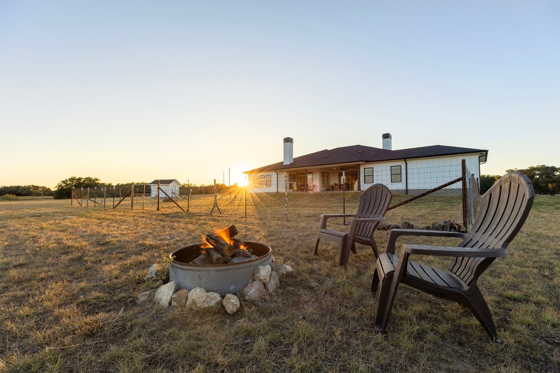 345 Judge's Road Burnet, TX 78611 - Photo 37 of 40 a backyard of a house with table and chairs