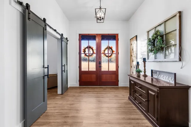 a view of a kitchen cabinets a window and wooden floor