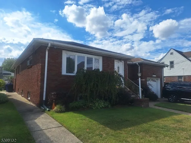 a view of house with yard and entertaining space