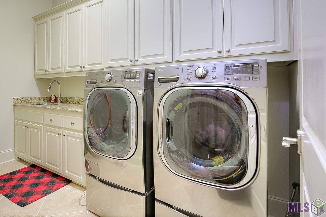 15514 Columbia Street Baton Rouge, LA 70817 - Photo 18 of 46 Laundry with abundance of cabinetry and built in sink