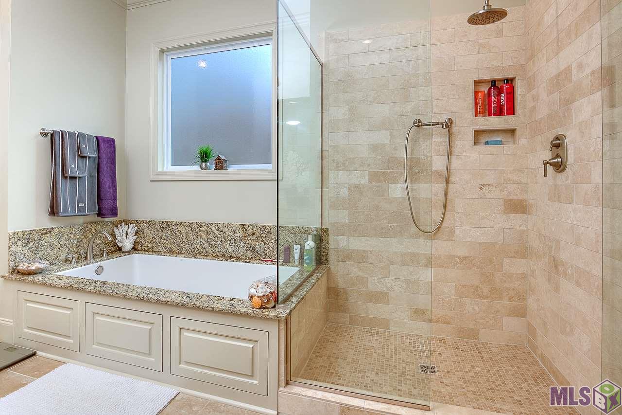 15514 Columbia Street Baton Rouge, LA 70817 - Photo 23 of 46 Tiled stand in shower and square accented tub
