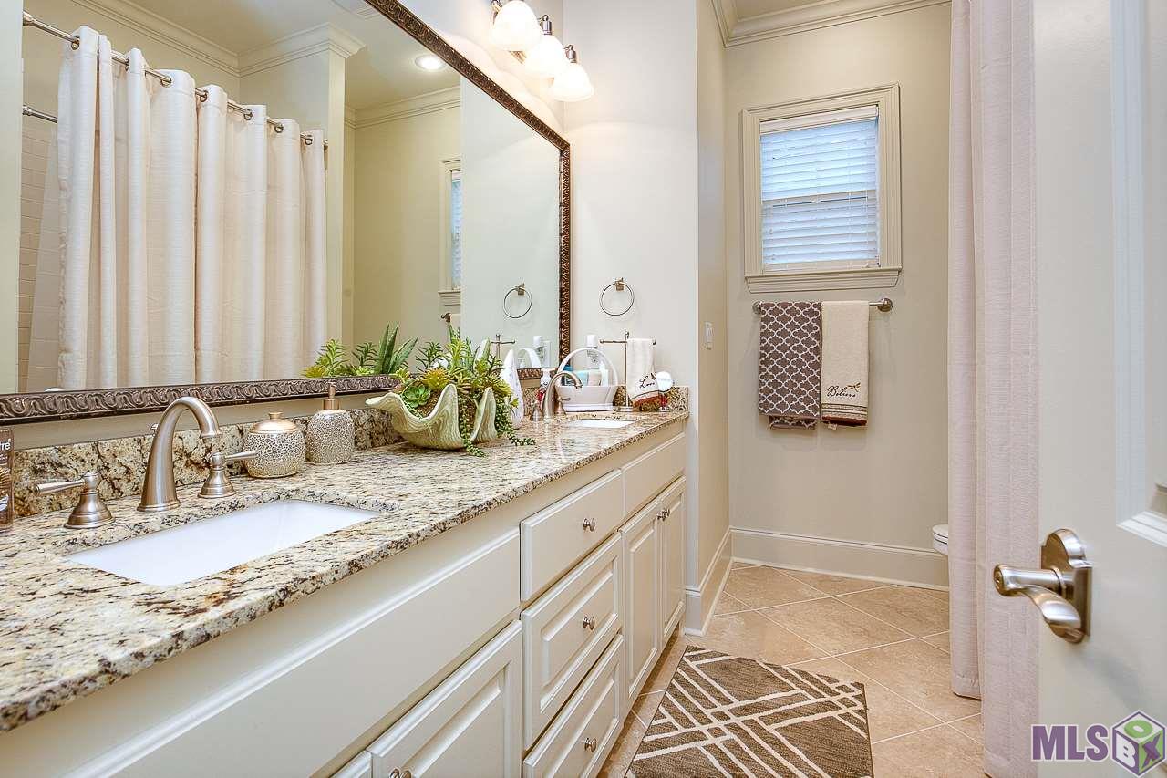 15514 Columbia Street Baton Rouge, LA 70817 - Photo 28 of 46 Hall bath features granite counters and designer fixtures