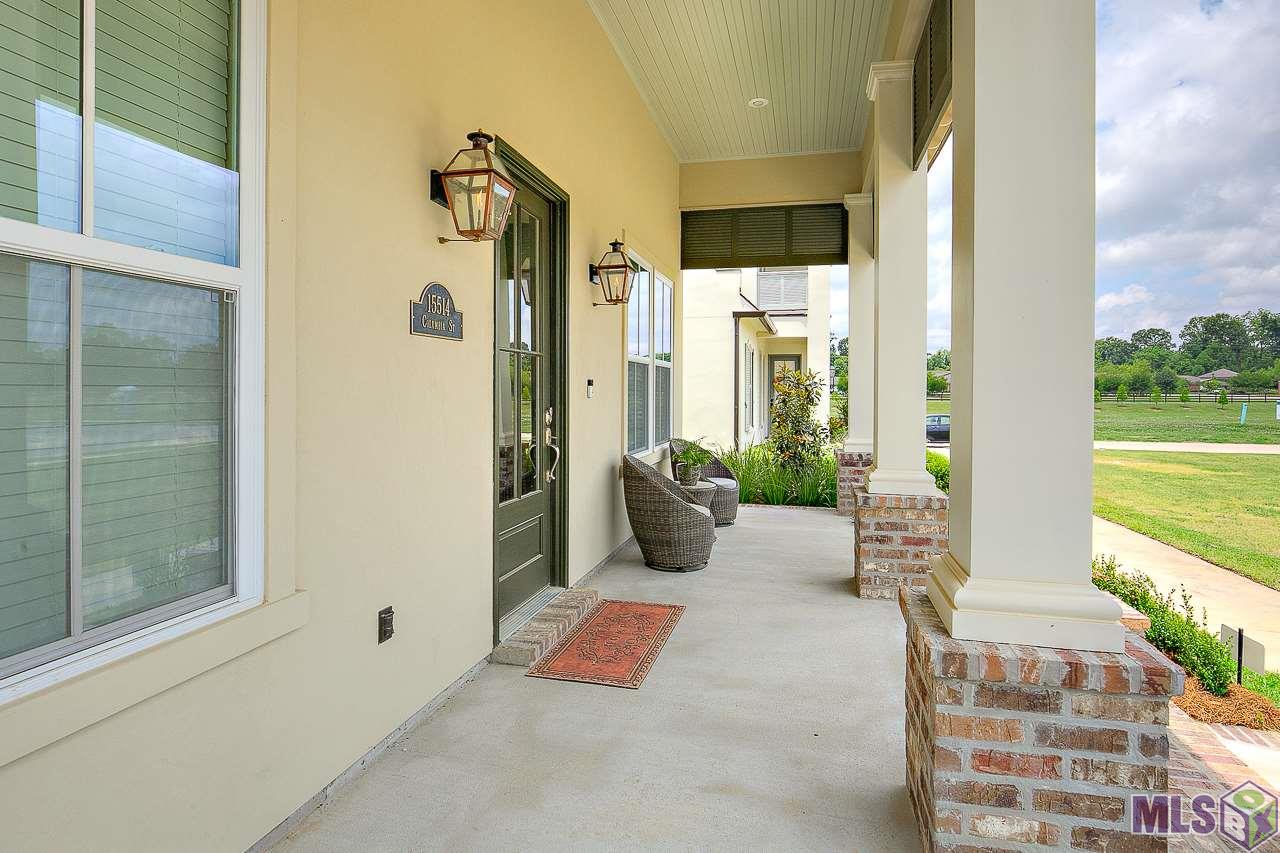 15514 Columbia Street Baton Rouge, LA 70817 - Photo 33 of 46 Front porch features square columns with brick accents and plantation trims