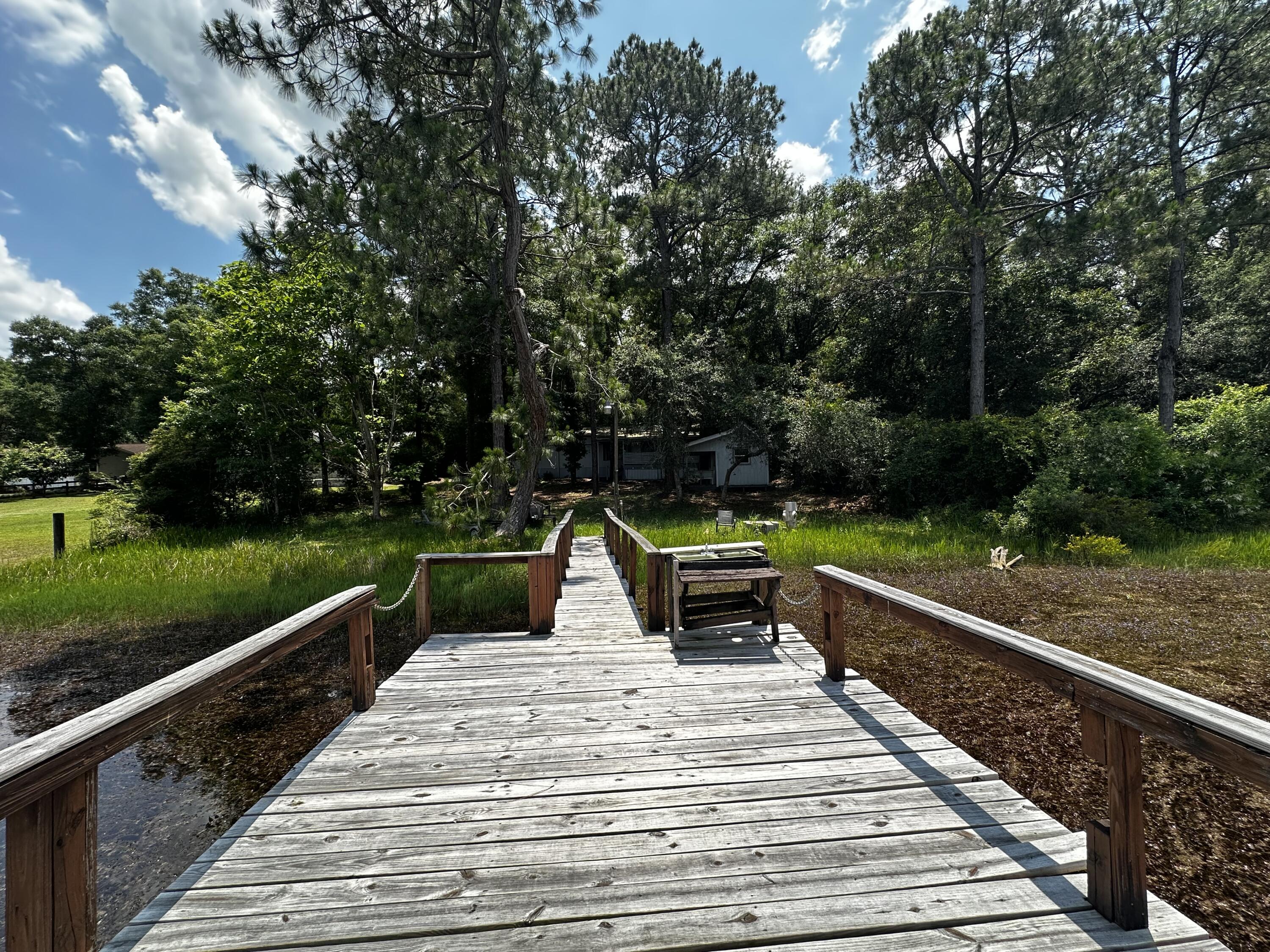 90 Bell Drive DeFuniak Springs, FL 32433 - Photo 6 of 27 a view of outdoor space with seating area