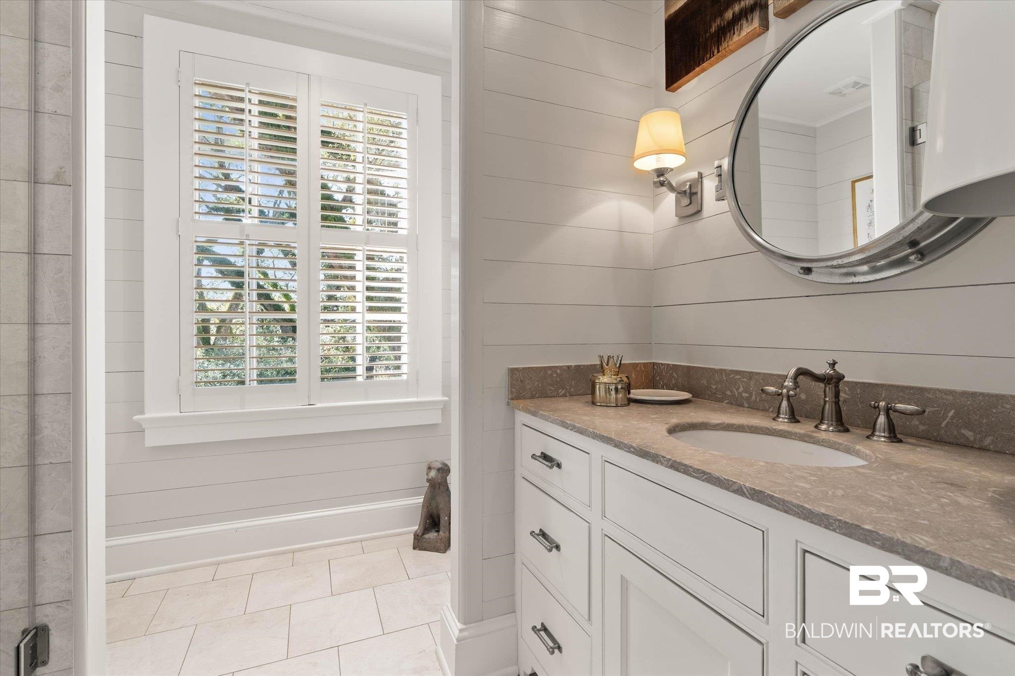 2256 De Leon Avenue Mobile, AL 36607 - Photo 36 of 61 Bathroom with vanity, wood walls, and light tile patterned floors