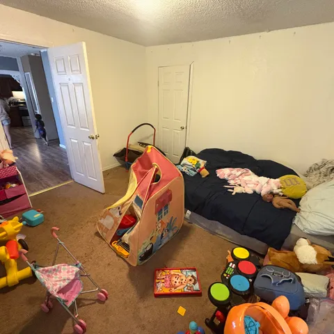 a bathroom with a sink vanity mirror and toilet