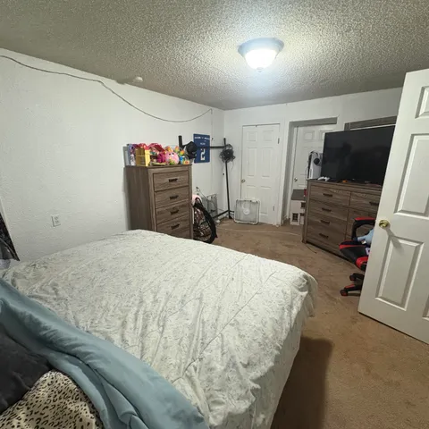 a view of a swimming pool with an outdoor space and seating area