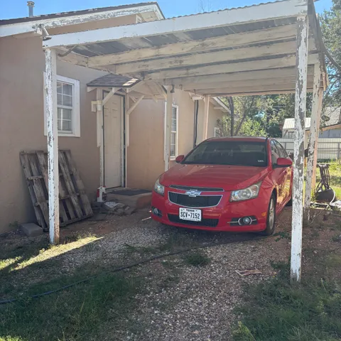 a view of road with large trees