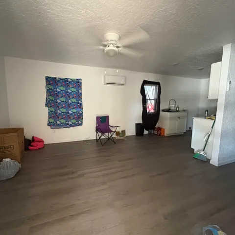 a kitchen that has a sink and a stove in it