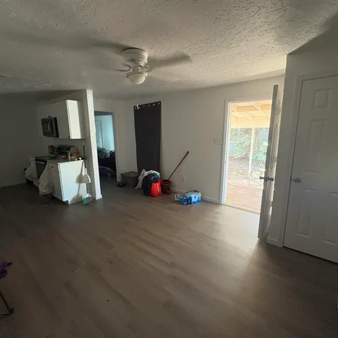 a close view of a sink and dishwasher with cabinets