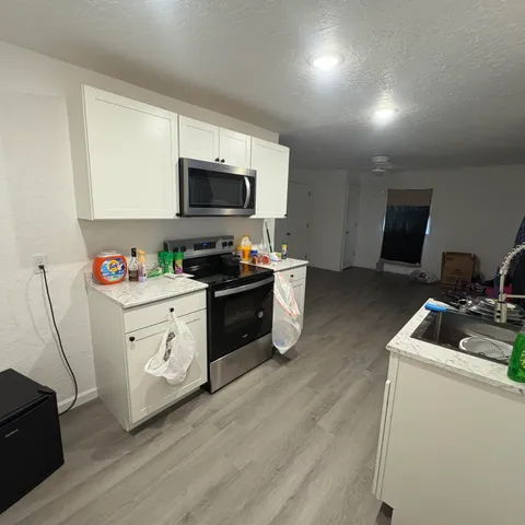 a backyard of a house with table and chairs