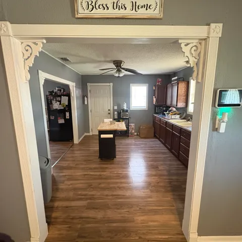 a kitchen with stainless steel appliances kitchen island granite countertop a stove a sink and a microwave