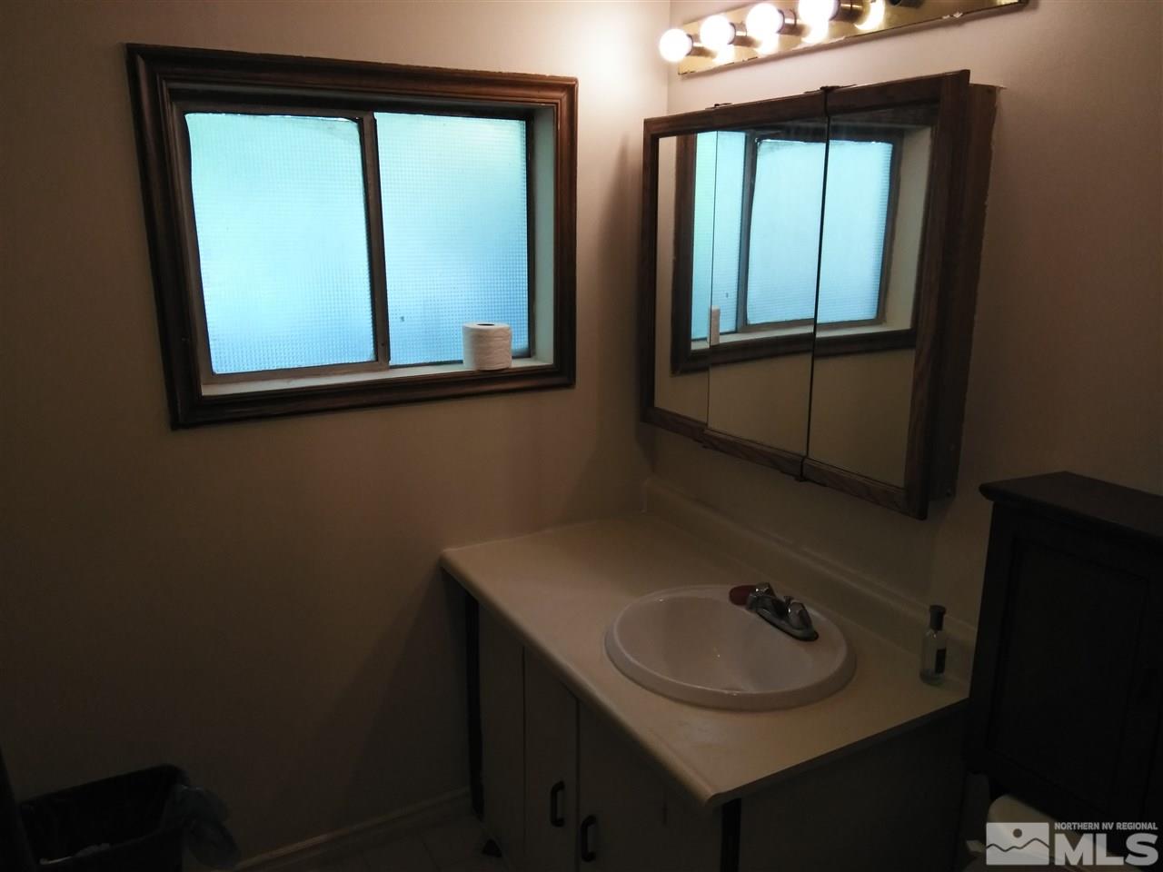 535 Apple Street Reno, NV 89502 - Photo 15 of 25 a bathroom with a sink and a mirror