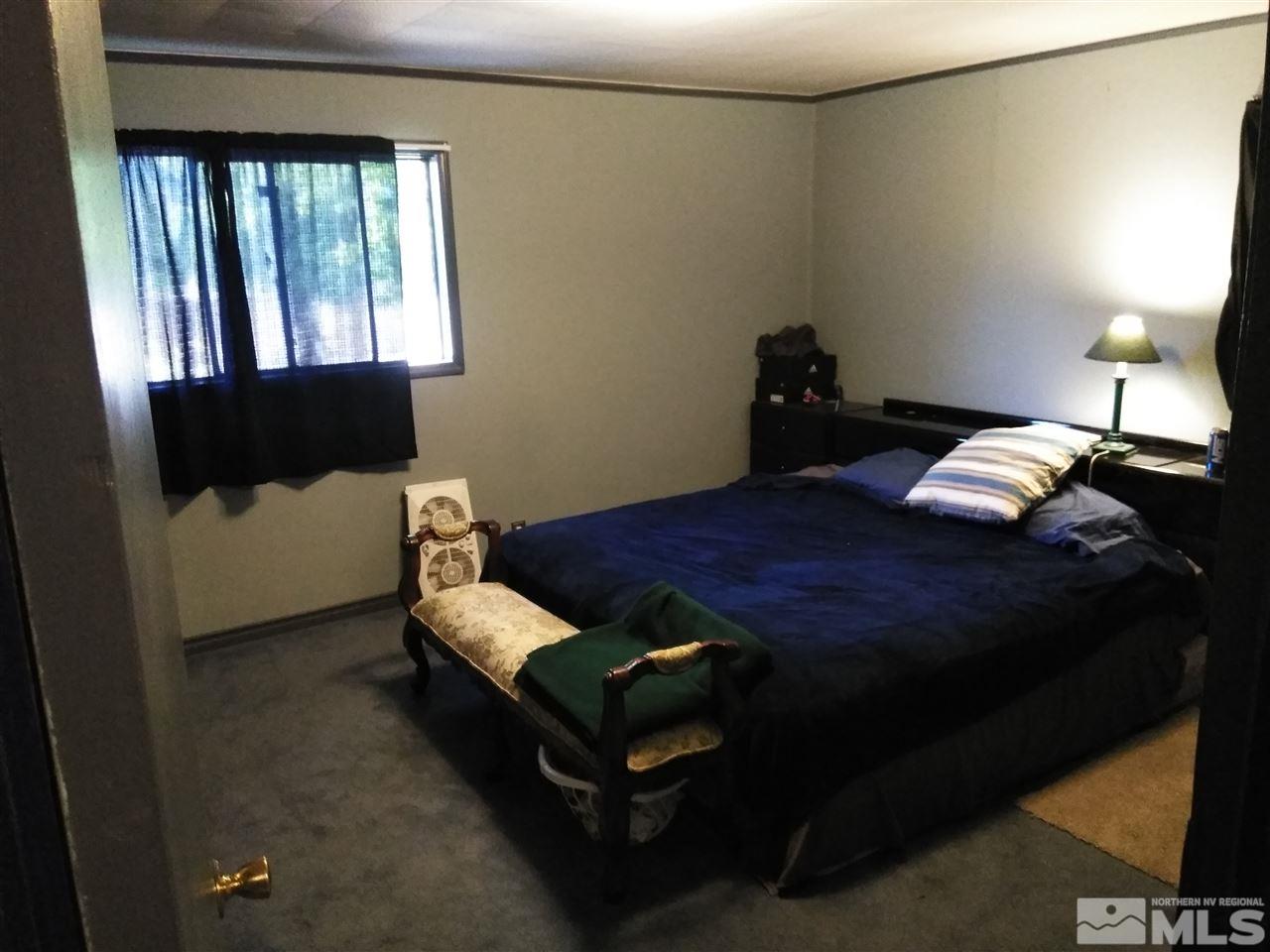 535 Apple Street Reno, NV 89502 - Photo 23 of 25 a bedroom with a bed and window