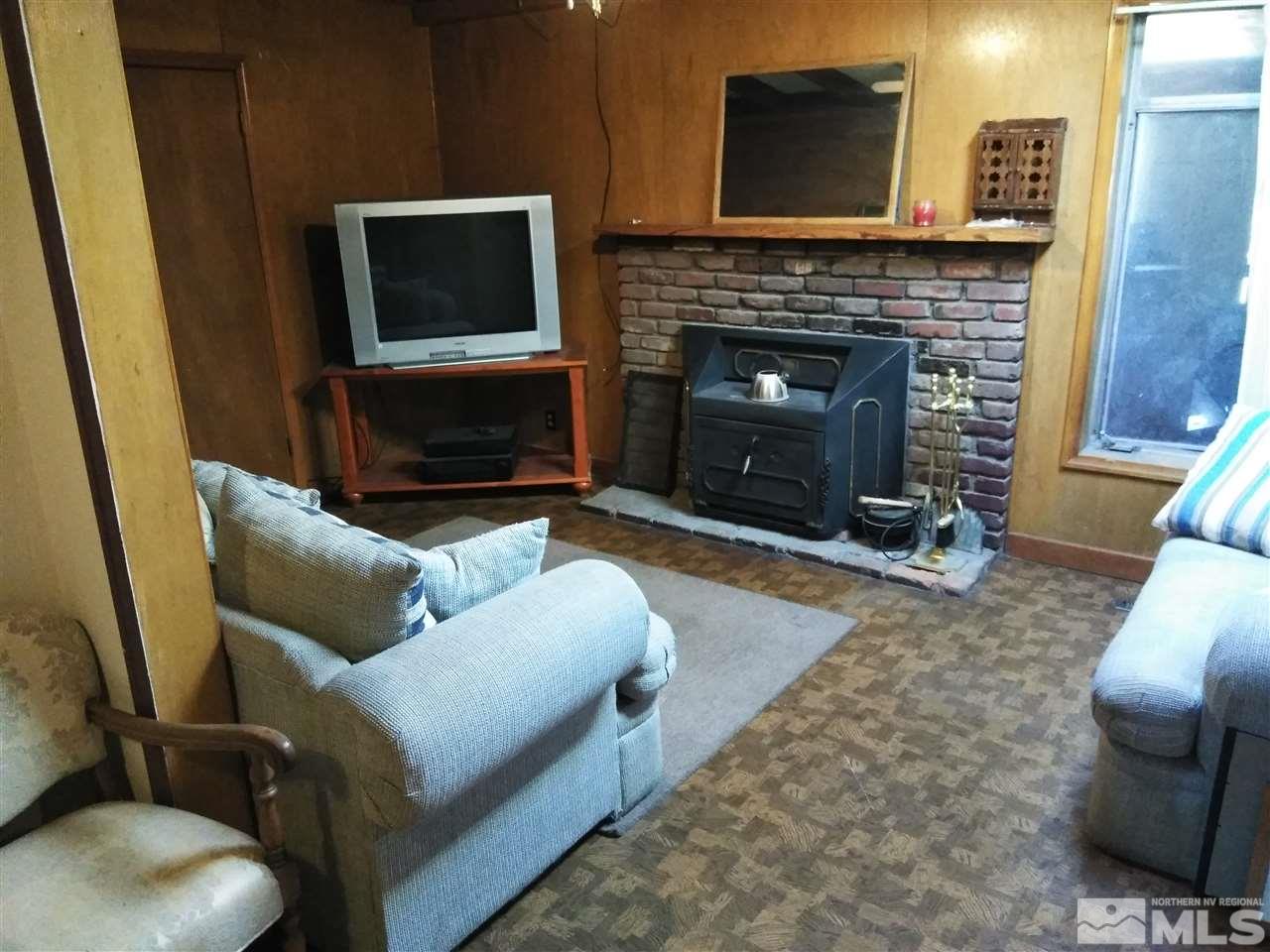 535 Apple Street Reno, NV 89502 - Photo 9 of 25 a living room with furniture and a fireplace