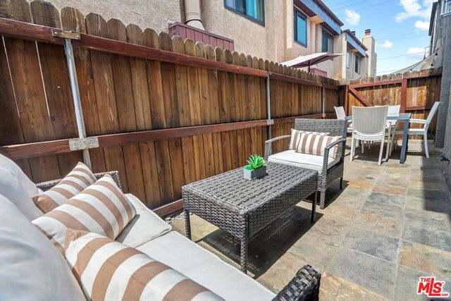 a view of balcony with two chairs