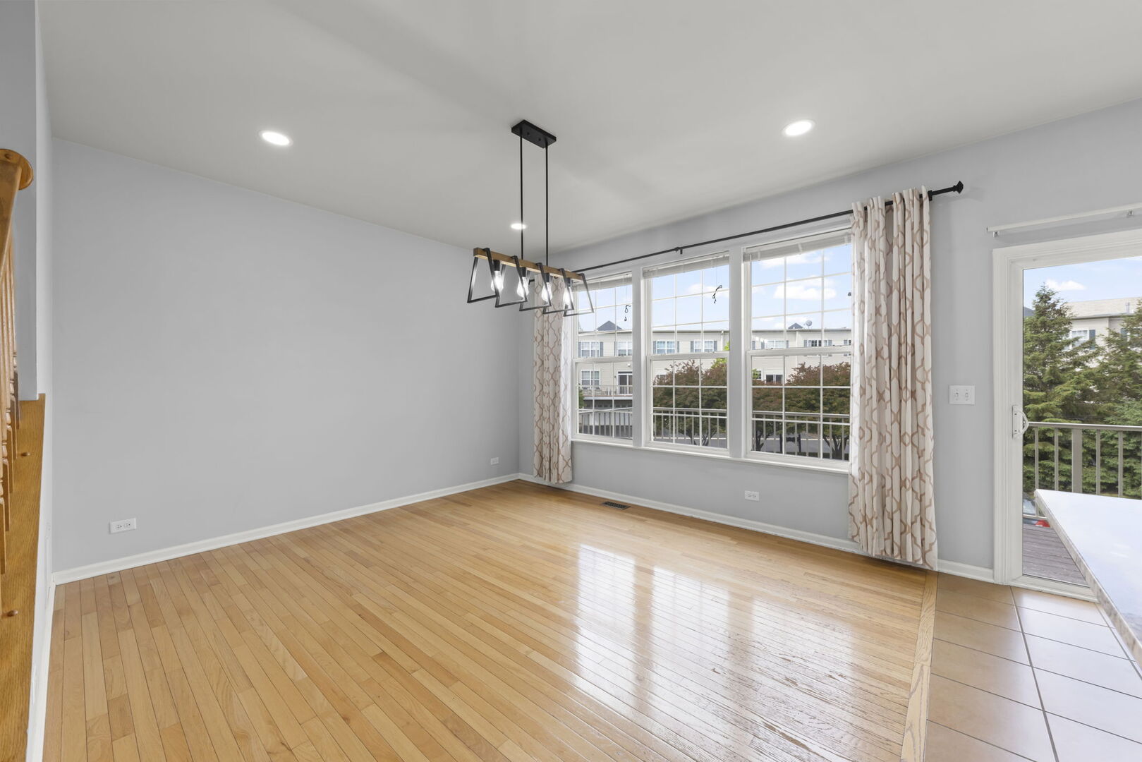 4216 Drexel Avenue Aurora, IL 60504 - Photo 12 of 48 a view of an empty room with wooden floor and a window