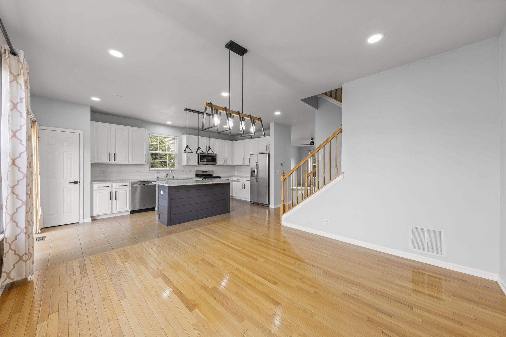 4216 Drexel Avenue Aurora, IL 60504 - Photo 14 of 48 a large kitchen with stainless steel appliances granite countertop a sink and cabinets