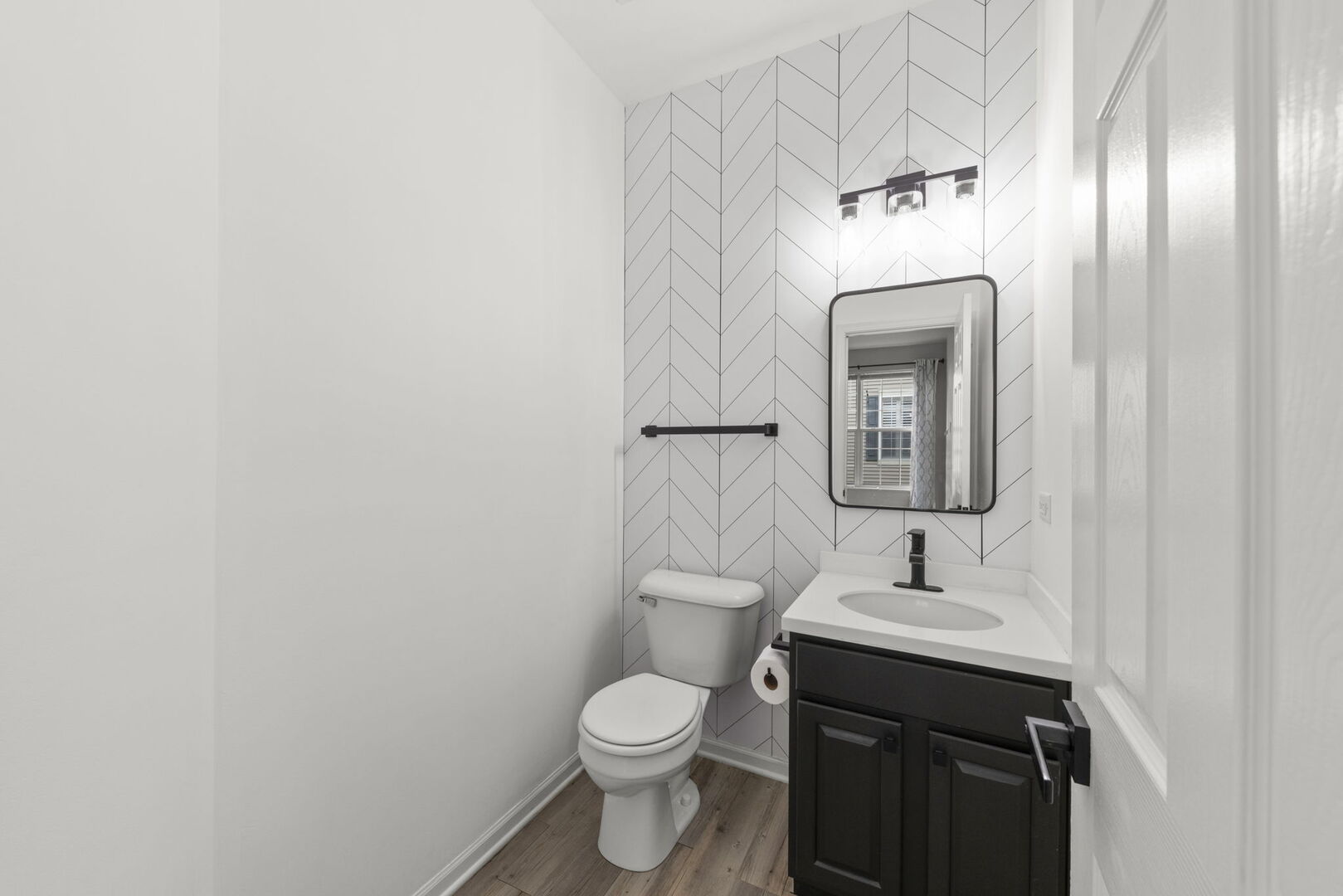 4216 Drexel Avenue Aurora, IL 60504 - Photo 15 of 48 a bathroom with a toilet sink and mirror