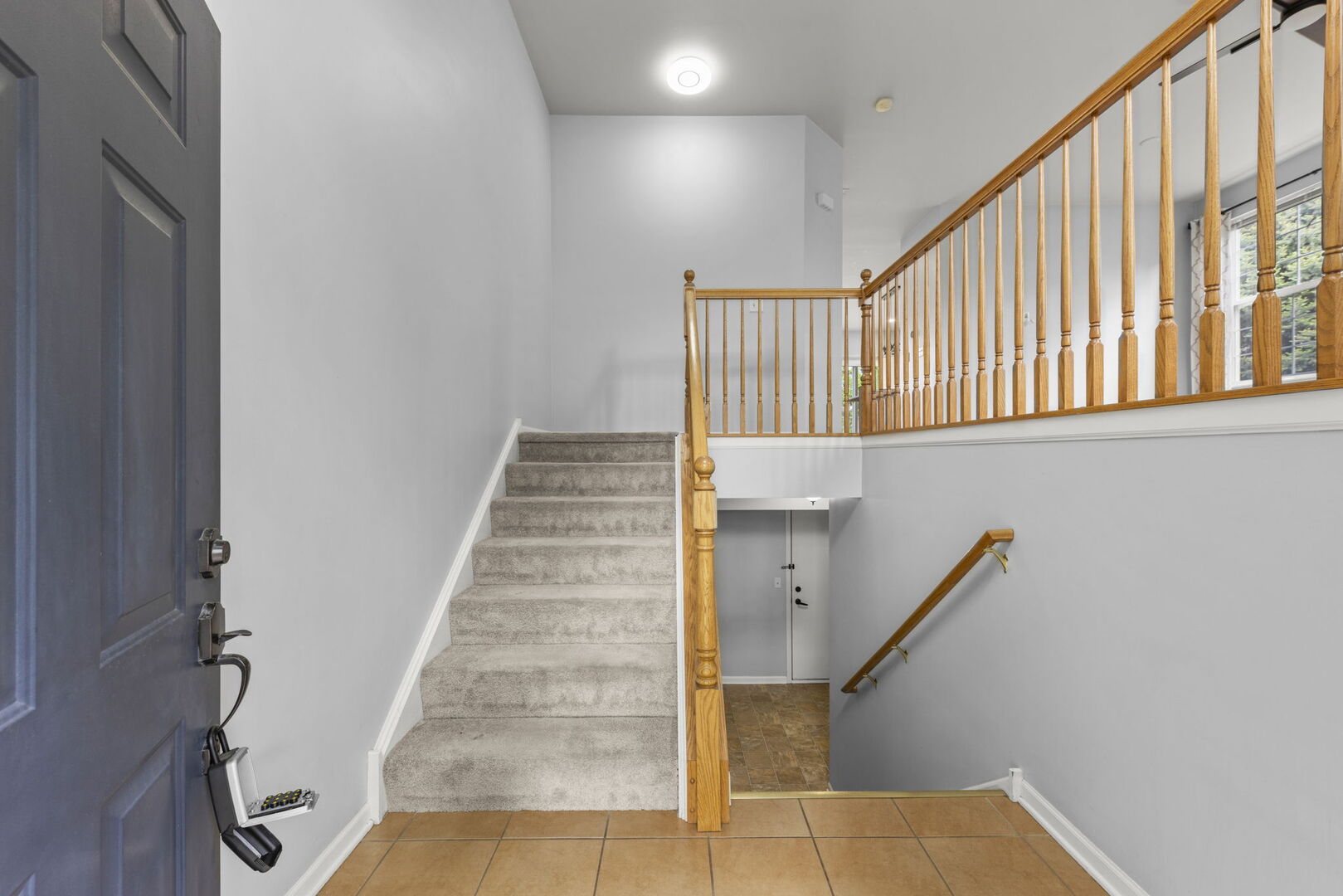 4216 Drexel Avenue Aurora, IL 60504 - Photo 3 of 48 a view of staircase with white walls and a window