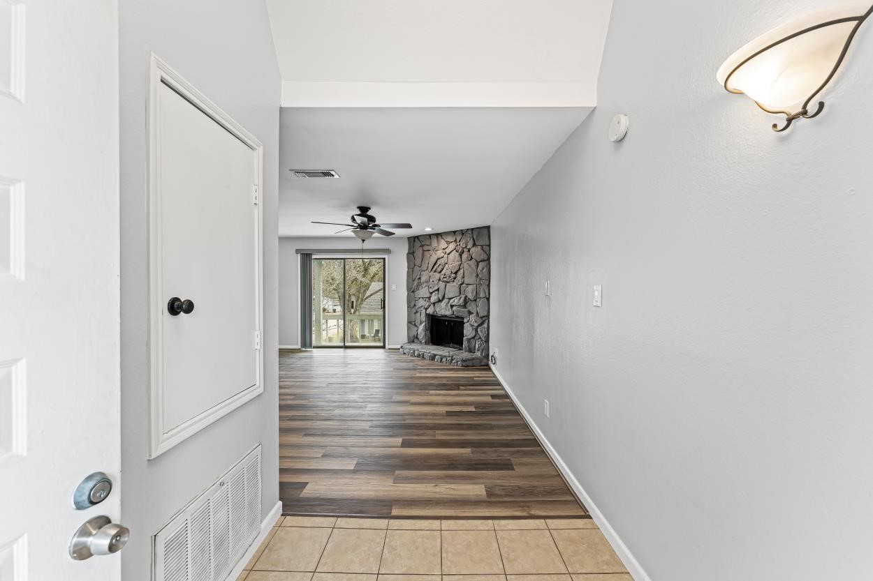 19 Hideaway Drive Friendswood, TX 77546 - Photo 4 of 11 a view of a hallway view with wooden floor and staircase