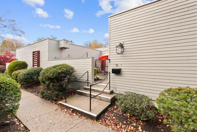 a view of a house with a potted plant