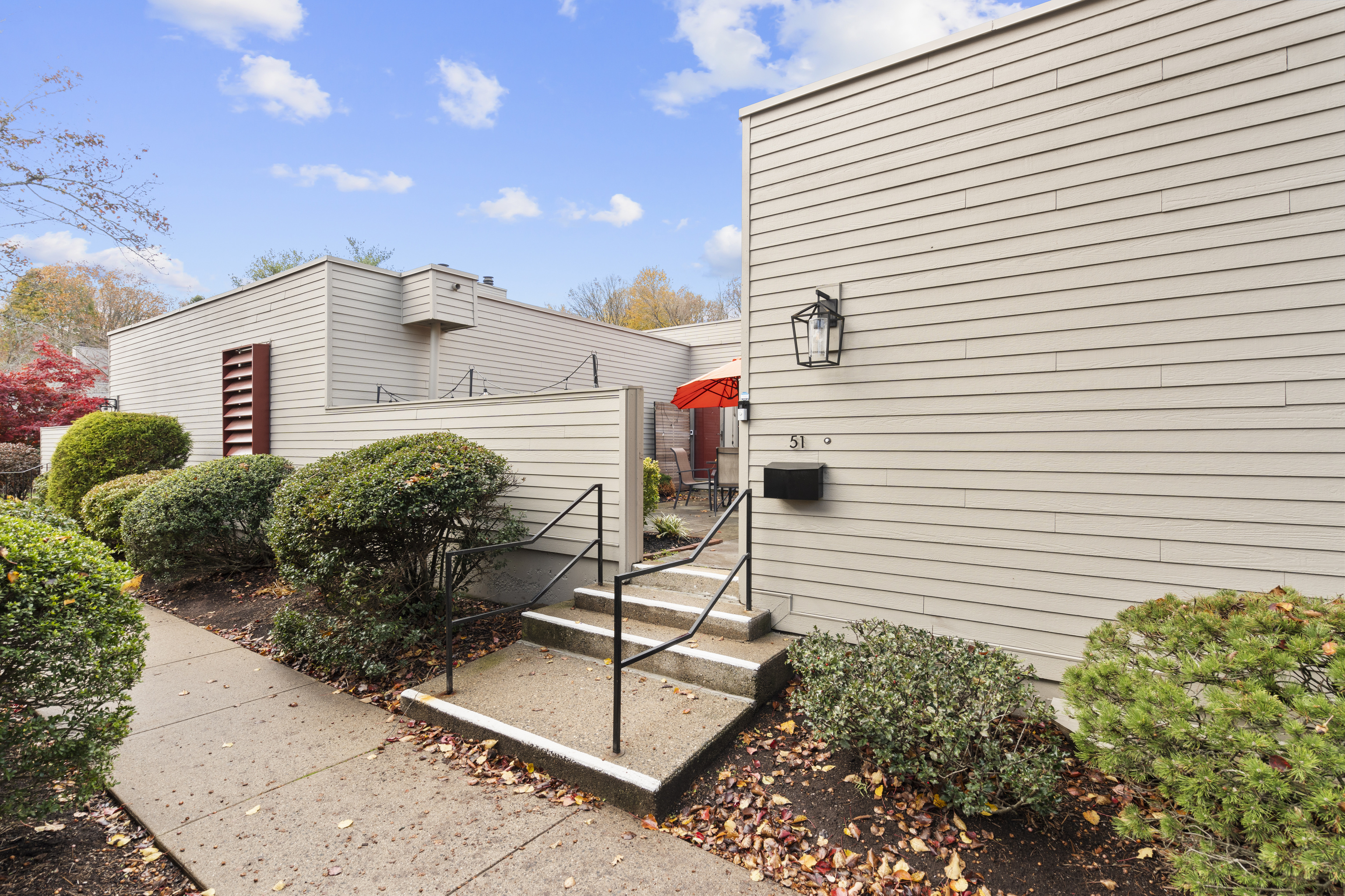 a view of a house with a potted plant