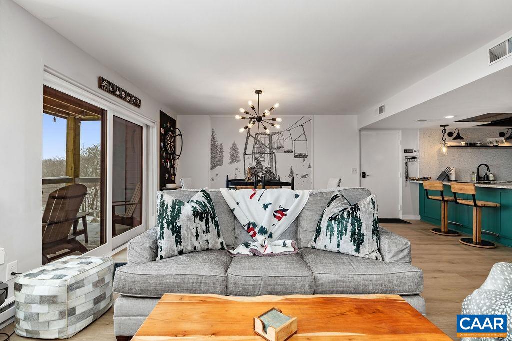 1411 Highlands Condos Roseland, VA 22967 - Photo 3 of 58 a living room with furniture fireplace and a table