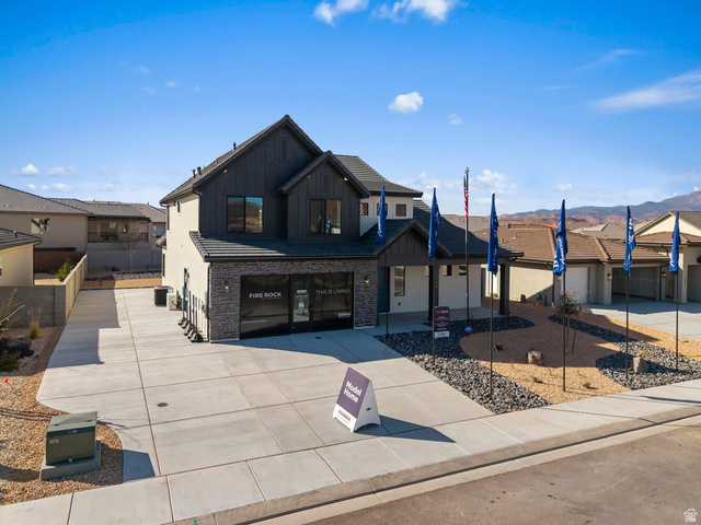 352 North Rhyolite Drive, Unit 89 Hurricane, UT 84737 - Photo 41 of 41 Contemporary two-story residence featuring a dark-stained wood vertical siding facade and light-colored stucco