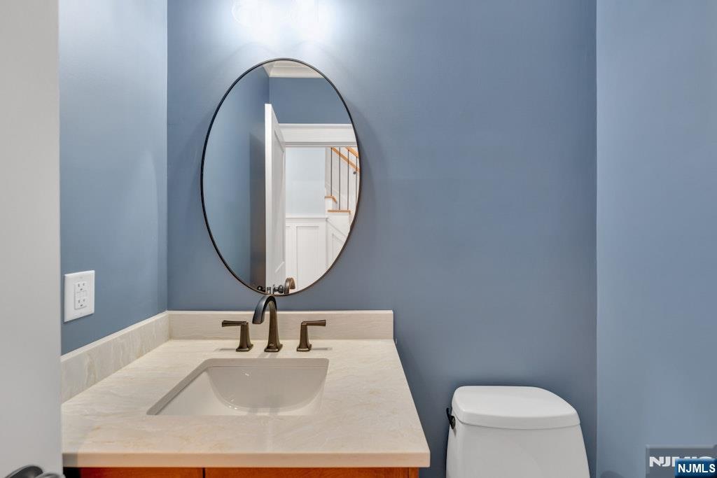 28 North Street Ramsey, NJ 07446 - Photo 20 of 50 a bathroom with a toilet and a sink