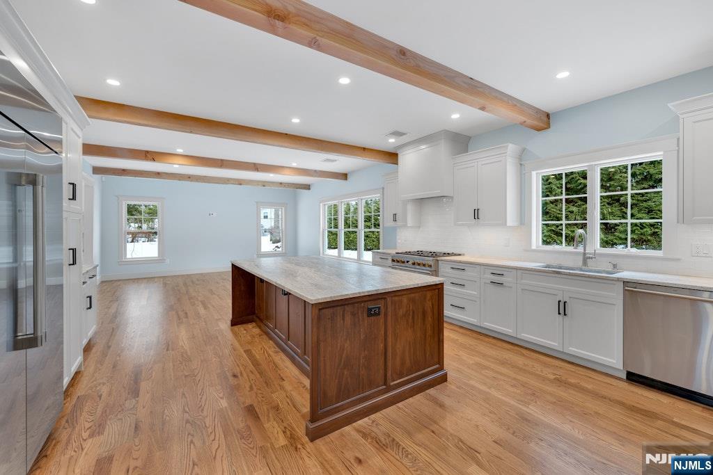 28 North Street Ramsey, NJ 07446 - Photo 2 of 50 a kitchen with granite countertop a stove and wooden floor