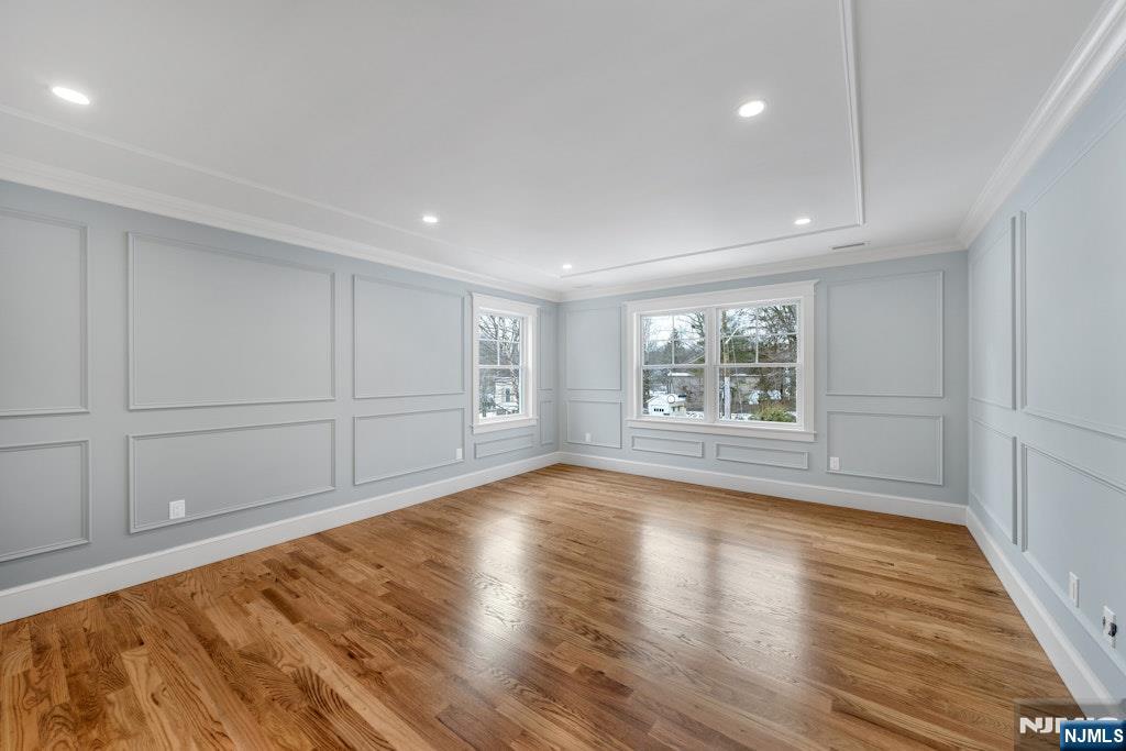 28 North Street Ramsey, NJ 07446 - Photo 25 of 50 a view of an empty room with wooden floor and a window