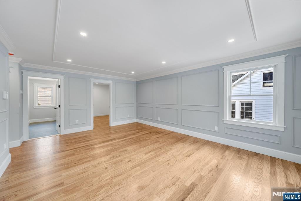 28 North Street Ramsey, NJ 07446 - Photo 26 of 50 a view of empty room with wooden floor and windows