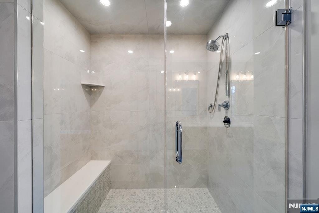 28 North Street Ramsey, NJ 07446 - Photo 30 of 50 a bathroom with a shower and a glass door
