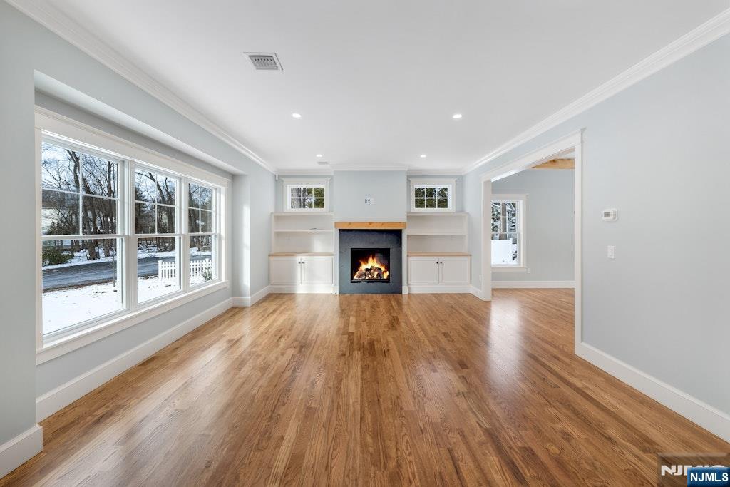 28 North Street Ramsey, NJ 07446 - Photo 6 of 50 a view of an empty room with wooden floor and a window