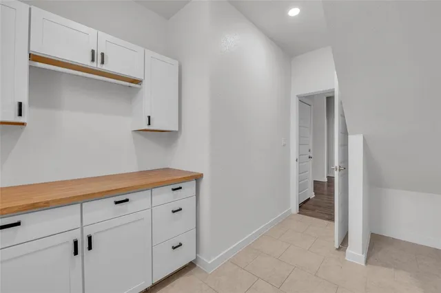 a view of cabinets with wooden floor