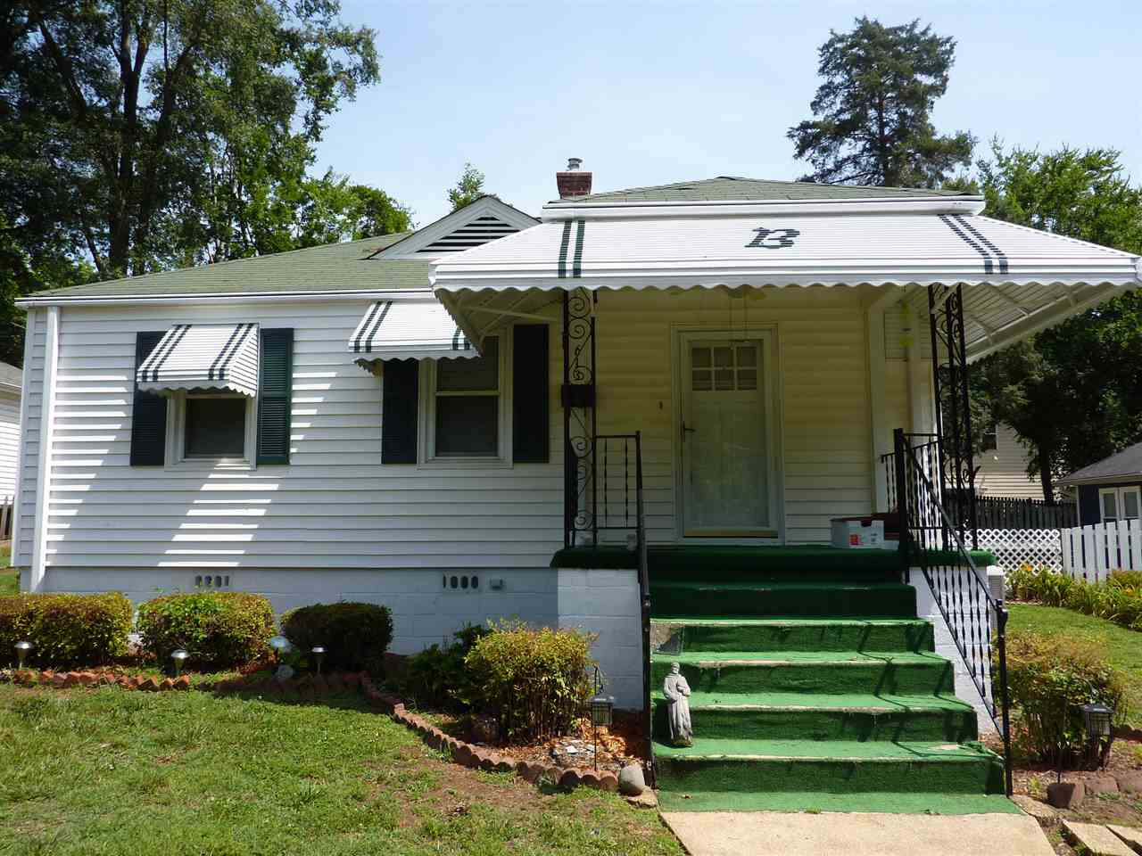 Cute as a button home near the peaceful, historic Mordecai district! Newly painted shutters and awnings give the home's exterior a fresh look. Exterior Front