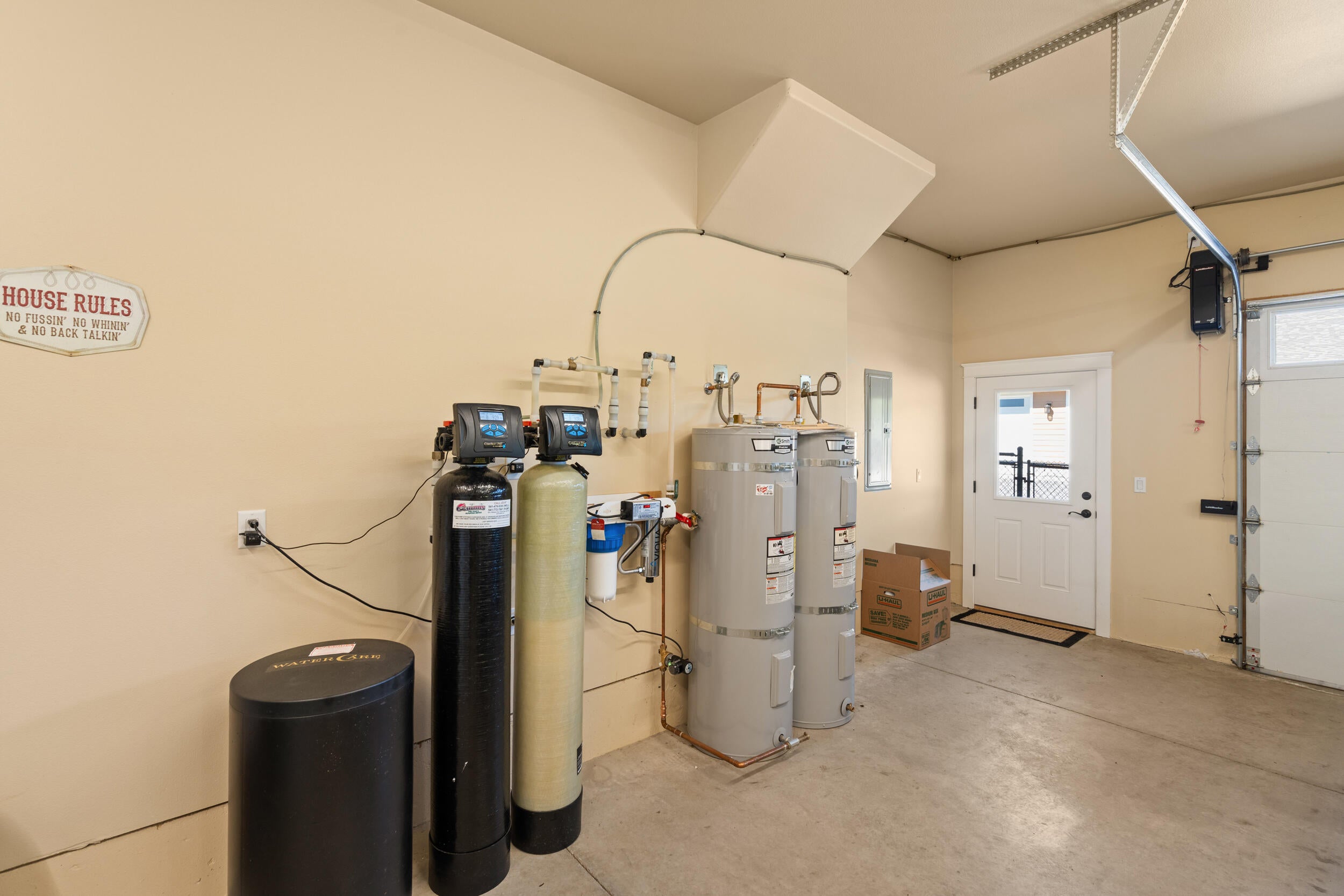 7765 Colonial Way Central Point, OR 97502 - Photo 34 of 50 Water treatment in attached garage