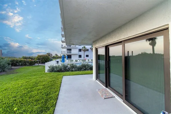 a view of a house with a yard and plants