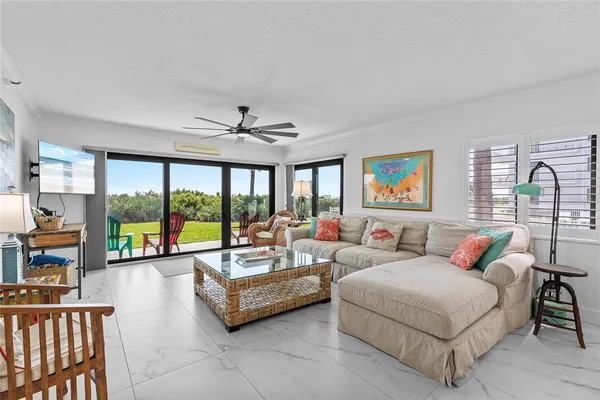 a living room with furniture and a large window